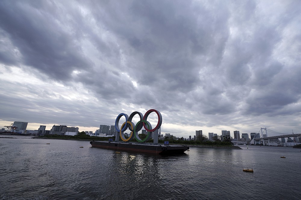 FILE - This April 12, 2021, file photo shows the Olympic rings floating in the water in the Odaiba section in Tokyo. Some nurses in Japan are incensed at a request from Tokyo Olympic organizers to have 500 of them dispatched to help out with the games. They say they’re already near the breaking point dealing with the coronavirus pandemic. A protest message saying that nurses were opposed to holding the Olympic went viral on Japanese Twitter recently, being retweeted hundreds of thousands of times. (AP Photo/Eugene Hoshiko, File)