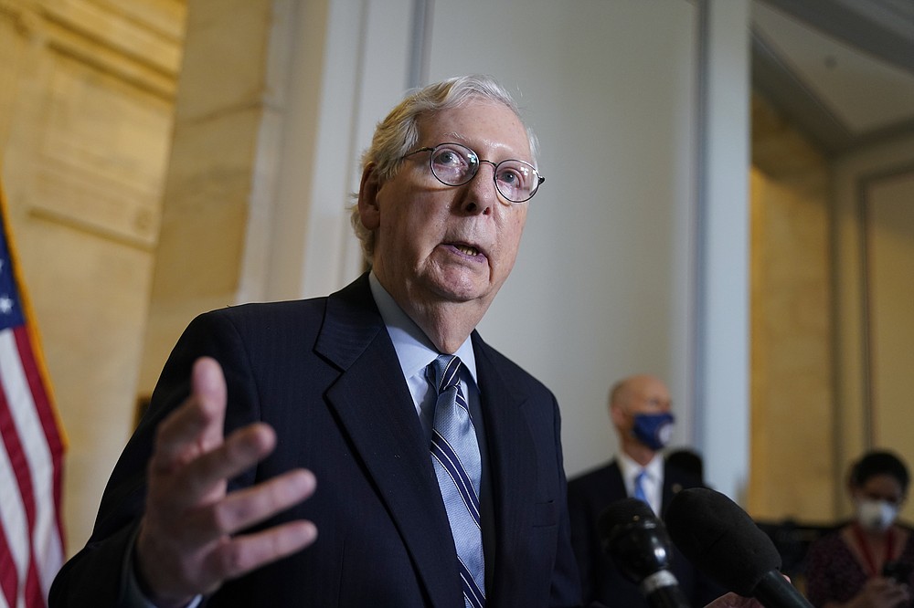 FILE - In this April 20, 2021, file photo, Senate Minority Leader Mitch McConnell, R-Ky., talks after a GOP policy luncheon, on Capitol Hill in Washington. McConnell says Republicans are willing to spend up to $600 billion for roads, bridges and other projects. That's far less than what President Joe Biden is seeking, but is in line with a new $568 billion proposal put forward by other Senate Republicans. (AP Photo/J. Scott Applewhite, File)