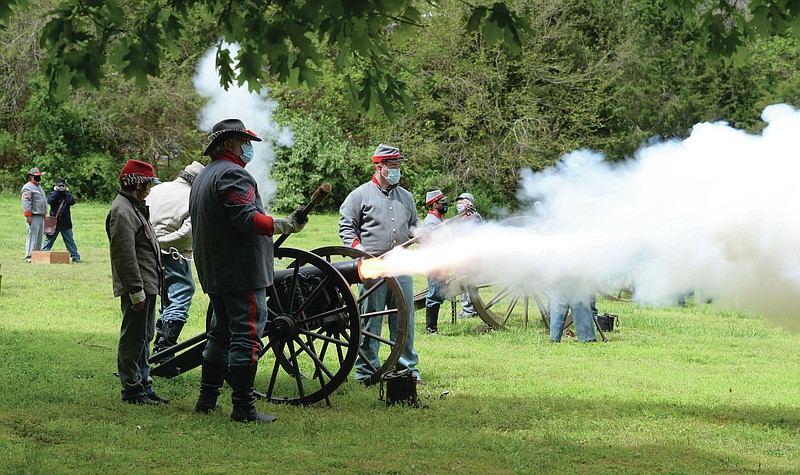 Members of the cannon demonstration crew for Prairie Grove Battlefield State Park, fire, from left, a mountain howitzer, a field cannon and a Parrott rifle Saturday, May 1, 2021, during an artillery demonstration at the park in Prairie Grove. The group is made up of members of the First Arkansas Mountain Artillery and the Seventh Arkansas Field Artillery historical re-enactment groups. Visit nwaonline.com/210502Daily/ for today's photo gallery. 
(NWA Democrat-Gazette/Andy Shupe)