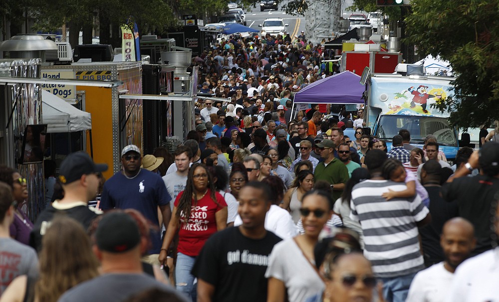Crowds thronged downtown Little Rock for the 2019 Main Street Food Truck Festival. After being canceled for 2020 because of the pandemic, the festival returns to Main Street Oct. 2. (Democrat-Gazette file photo/Thomas Metthe)