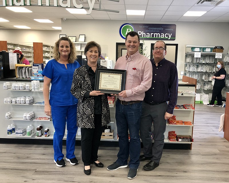 Arkansas Pharmacists Association Director of Professional Affairs Nicki Hilliard, center, presents a Strike Team Pharmacy Certificate of Recognition to Village Healthmart staff members Lori Saveall and Michael Butler, doctors of pharmacy, and Todd Beagle. Not pictured is Cody Turner, doctor of pharmacy. - Submitted photo