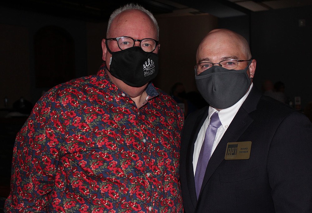 Ed McClure, APT artistic director (left), and Kris Isham, board chairman, welcome guests to SeasonLeaks! 36.
(NWA Democrat-Gazette/Carin Schoppmeyer)