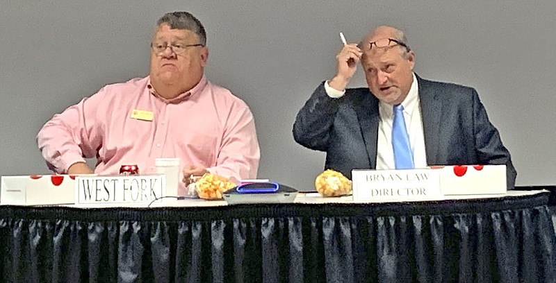 John Karnes, West Fork superintendent, and Bryan Law, Northwest Arkansas Educational Service Cooperative director, lead the coop's monthly board meeting Tuesday in Farmington. (NWA-Democrat-Gazette/Mary Jordan)