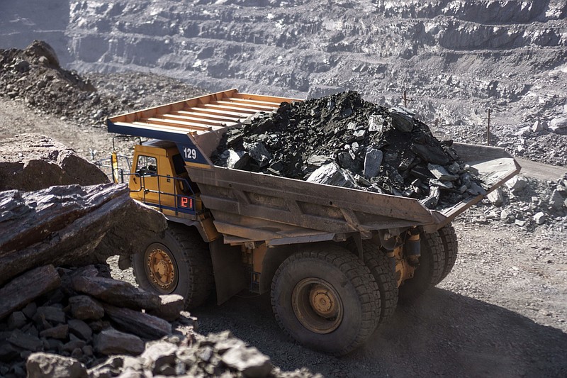 A dump truck transports iron ore at the open pit mine, operated by ArcelorMittal, in Kryvyi Rih, Ukraine, on March 6, 2019. MUST CREDIT: Bloomberg photo by Vincent Mundy.