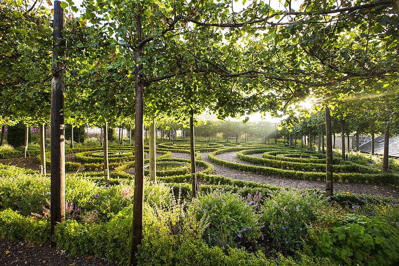 At the Hopetoun House walled garden in Scotland, the owner uses boxwood and clipped linden trees to create a place of green architecture. Elsewhere, the garden is a naturalistic riot of perennials and grasses. (Claire Takacs via The Washington Post)