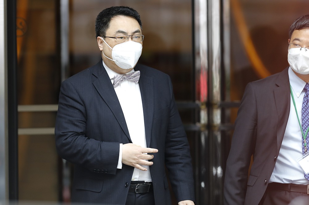 The ambassador of the Permanent Mission of the People's Republic of China to the United Nations, Wang Qun, leaves the 'Grand Hotel Wien' where closed-door nuclear talks with Iran take place in Vienna, Austria, Friday, May 7, 2021. (AP Photo/Lisa Leutner)
