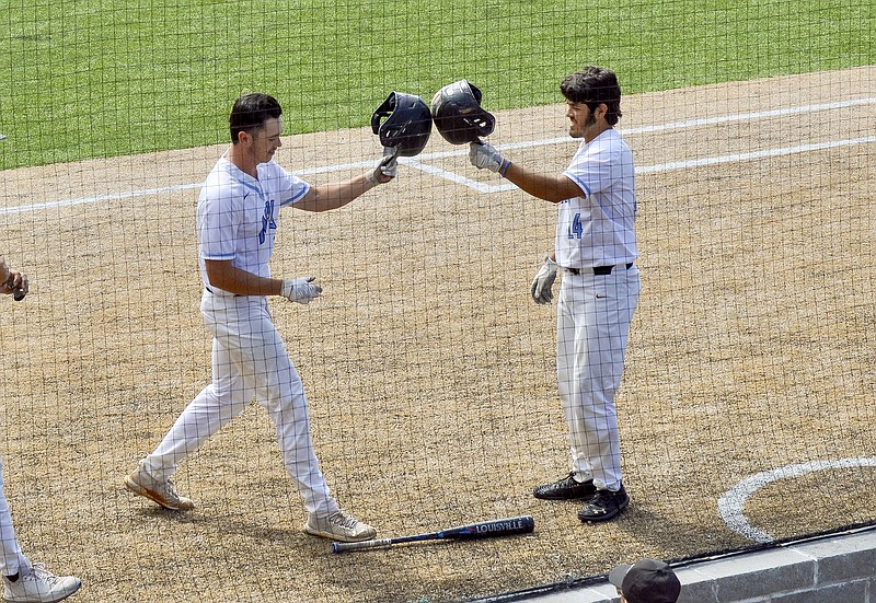 National Park's Jesus Minjarez, right, congratulates Cole Rodriguez after Rodriguez hit a home run in the second game of Friday's doubleheader against UA Rich Mountain. - Photo by Brandon Smith of The Sentinel-Record