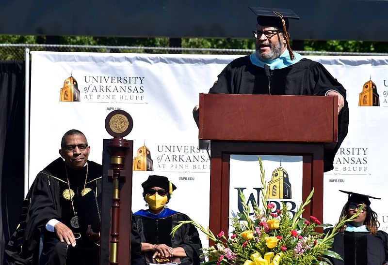 Bestselling author and political commentator Michael Eric Dyson delivers the commencement address as UAPB Chancellor Laurence B. Alexander listens behind the university mace during graduation Saturday, May 8, 2021, at Simmons Bank Field. (Pine Bluff Commercial/I.C. Murrell)