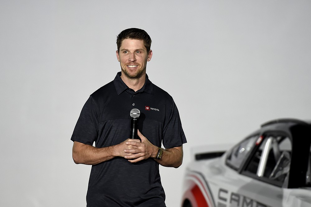 Driver Denny Hamlin talks about Toyota Camry Next Gen Cup car that will be used in the 2022 season during the NASCAR media event in Charlotte, N.C., Wednesday, May 5, 2021. (AP Photo/Mike McCarn)