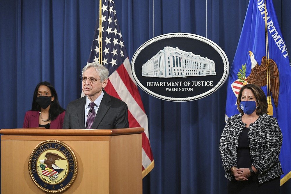 Attorney General Merrick Garland speaks at the Department of Justice in Washington as Assistant Attorney General Vanita Gupta and Assistant Attorney General Lisa Monaco on Monday, April 26, 2021.  Listen.  The Justice Department is opening a full investigation into Louisville policing following the March 2020 death of Breonna Taylor, who was shot and killed by police in a raid on her home.  (Almond Ngan / Pool via AP)