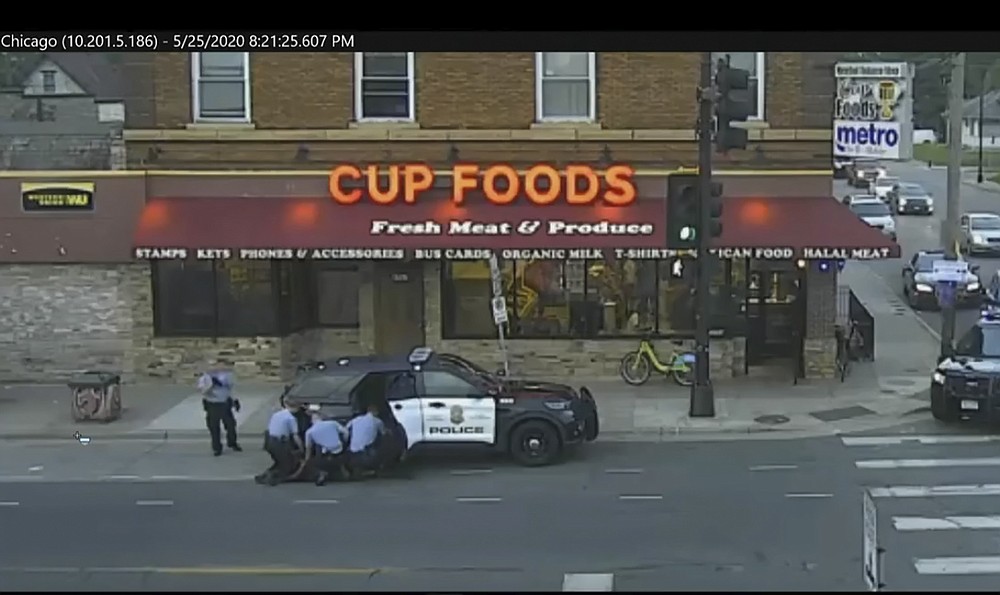 In this May 25, 2020 file image from a surveillance video, Minneapolis police officers from left Tou Thao, Derek Chauvin, J. Alexander Kueng and Thomas Lane attempt to arrest George Floyd in Minneapolis, Minnesota (judicial TV via AP ), Pool, file)