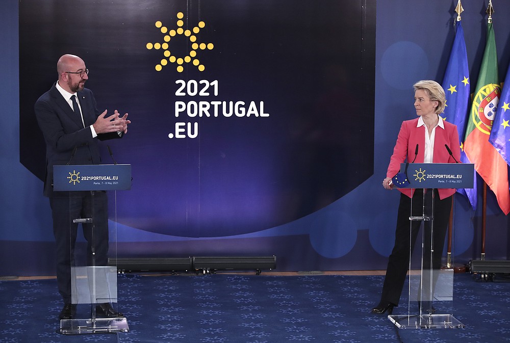 European Commission President Ursula von der Leyen, right, and European Council President Charles Michel participate in a media conference at an EU summit in Porto, Portugal, Saturday, May 8, 2021. On Saturday, EU leaders held an online summit with India's Prime Minister Narendra Modi, covering trade, climate change and help with India's COVID-19 surge. (AP Photo/Luis Vieira)