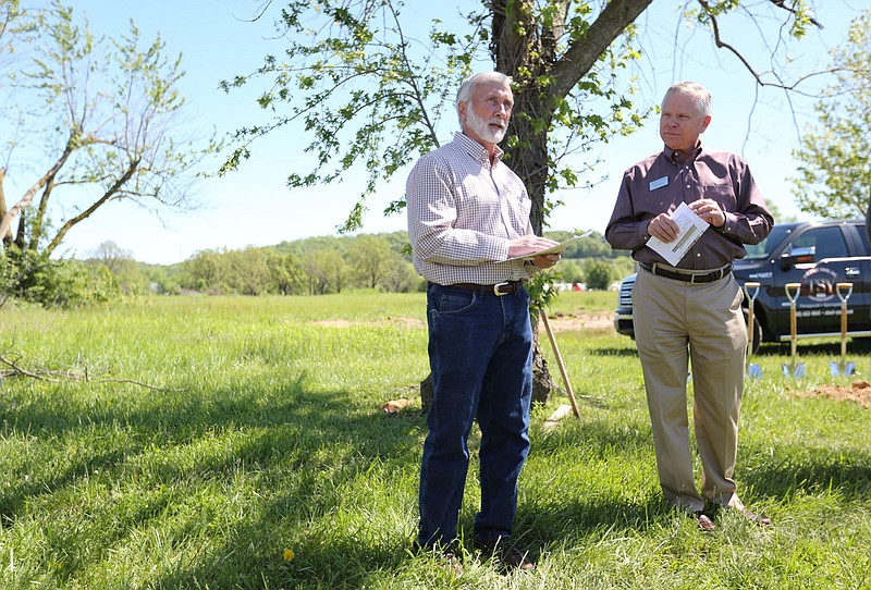 Bill Rogers (right), president of the Springdale Chamber of Commerce, listens to Mark Broadway, general manager of The Steel Yard, Inc., Wednesday, May 5, 2021, before participating in a groundbreaking ceremony for The Steel Yard, Inc., with other local officials and business men and women at 1768 E. Mountain Road, the new site in Springdale. The Steel Yard is a steel service center providing carbon steel, stainless steel and aluminum products. Check out nwaonline.com/210509Daily/ and nwadg.com/photos for a photo gallery.
(NWA Democrat-Gazette/David Gottschalk)