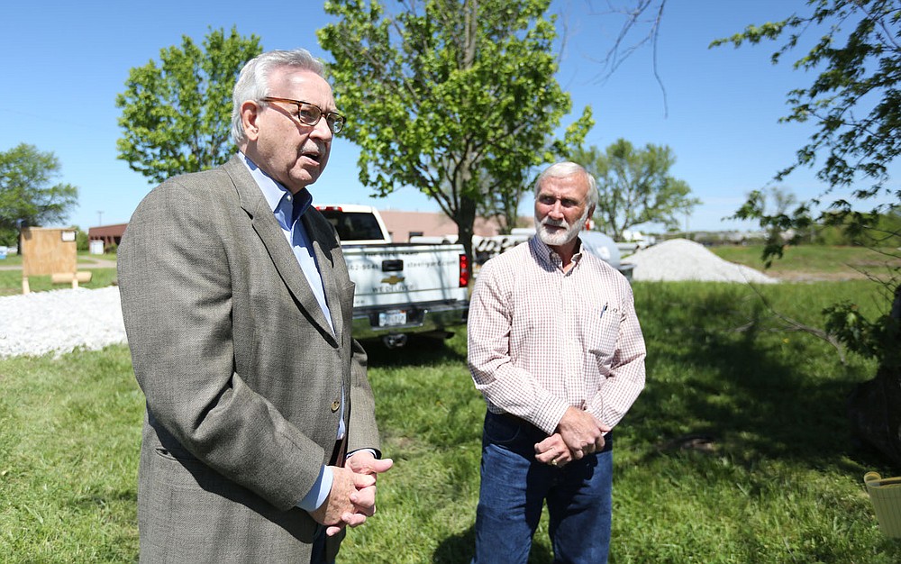 Mark Broadway (right), general manager of The Steel Yard, Inc., listens to Jerry Horton, sales manager, Wednesday, May 5, 2021, after participating in a groundbreaking ceremony for The Steel Yard, Inc., with other local officials and business men and women at 1768 E. Mountain Road, the new site in Springdale. The Steel Yard is a steel service center providing carbon steel, stainless steel and aluminum products. Check out nwaonline.com/210509Daily/ and nwadg.com/photos for a photo gallery.
(NWA Democrat-Gazette/David Gottschalk)