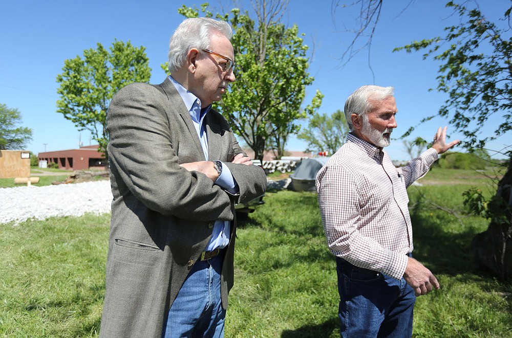 Jerry Horton (left), sales manager with The Steel Yard, Inc., listens to Mark Broadway, general manager of The Steel Yard, Inc., Wednesday, May 5, 2021, after participating in a groundbreaking ceremony for The Steel Yard, Inc., with other local officials and business men and women at 1768 E. Mountain Road, the new site in Springdale. The Steel Yard is a steel service center providing carbon steel, stainless steel and aluminum products. Check out nwaonline.com/210509Daily/ and nwadg.com/photos for a photo gallery.
(NWA Democrat-Gazette/David Gottschalk)