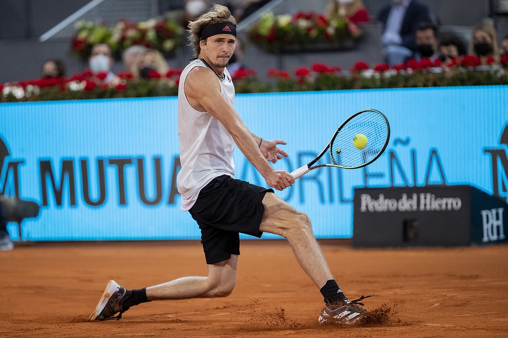 Germany's Alexander Zverev returns the ball to Italy's Matteo Berrettini during the men's final match at the Mutua Madrid Open tennis tournament in Madrid, Spain, Sunday, May 9, 2021. (AP Photo/Bernat Armangue)