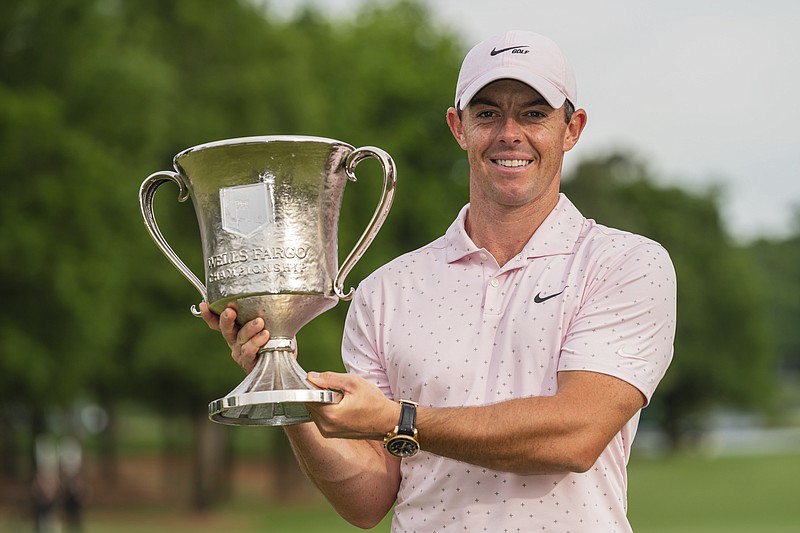 Rory McIlroy holds the trophy after winning during the fourth round of the Wells Fargo Championship golf tournament at Quail Hollow on Sunday, May 9, 2021, in Charlotte, N.C. (AP Photo/Jacob Kupferman)