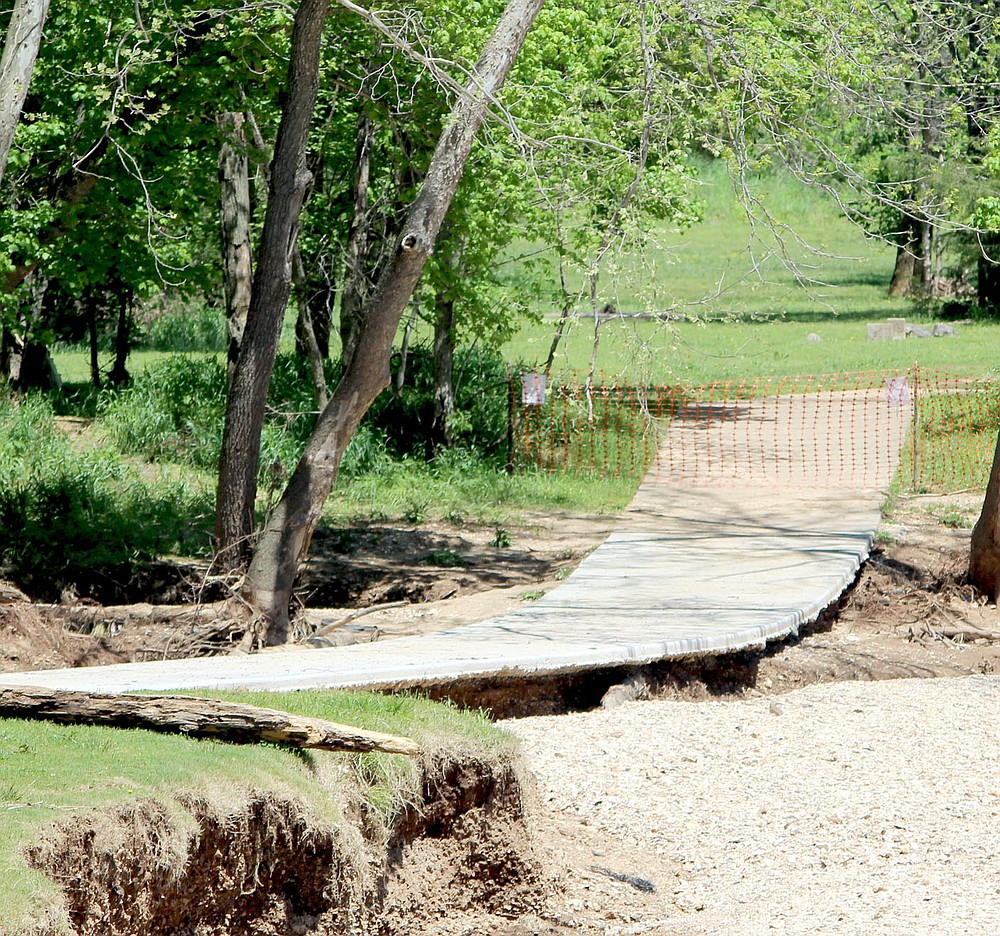 Keith Bryant/The Weekly Vista
A portion of the Lake Bella Vista trail, which has been closed for repairs, was undercut by flood waters during the late April rainstorms.