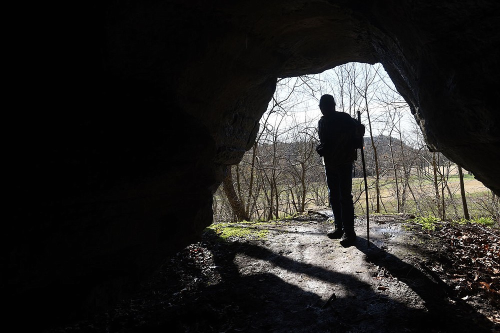Visitors pass numerous caves and crevices along the Little Sugar trail system. This cave is a feature of the Danger Will Robinson trail along Little Sugar Creek.
(NWA Democrat-Gazette/Flip Putthoff)