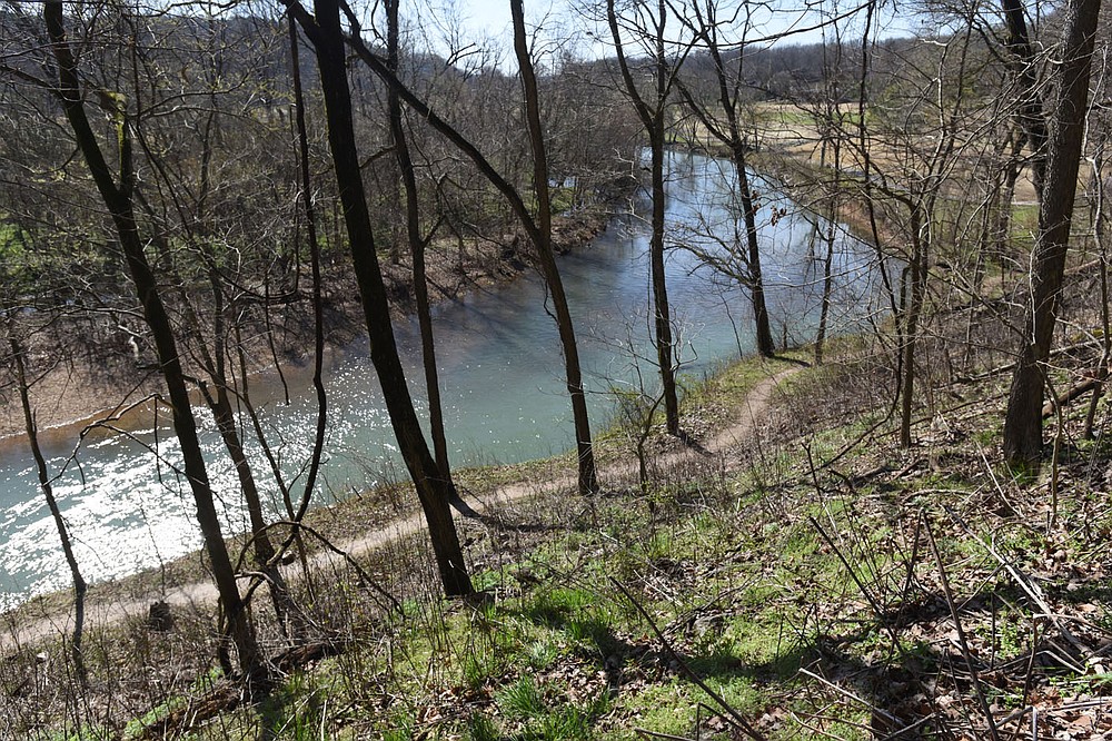 A lower trail can be seen March 26 2021 from a higher trail along Little Sugar Creek.
(NWA Democrat-Gazette/Flip Putthoff)