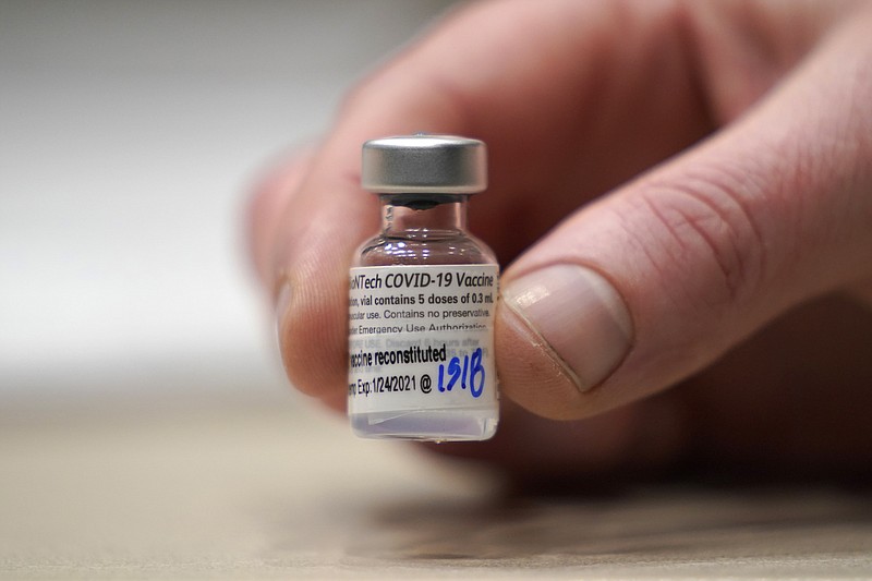 FILE - This Jan. 24, 2021, file photo shows a vial of the Pfizer vaccine for covid-19 in Seattle. U.S. regulators on Monday, May 10, 2021, expanded use of Pfizer's shot to those as young as 12, sparking a race to protect middle and high school students before they head back to class in the fall. (AP Photo/Ted S. Warren, File)
