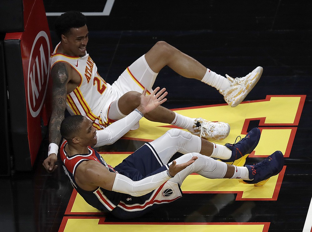 Washington Wizards guard Russell Westbrook (4) dribbles the ball during the  second half of an NBA basketball game against Milwaukee Bucks forward  Giannis Antetokounmpo (34), Saturday, March 13, 2021, in Washington. The