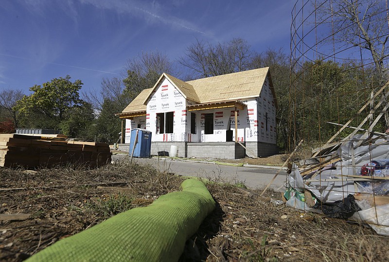 The Willow Bend home project construction site is seen Oct. 31 in south Fayetteville. The Walton Family Foundation is providing Partners for Better Housing a $2 million grant to expand its efforts regionally.
(File photo/NWA Democrat-Gazette/Charlie Kaijo)