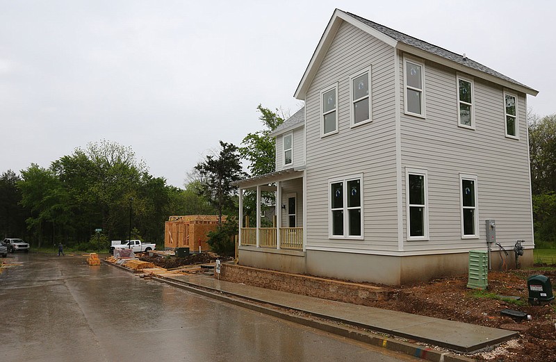 New home construction Tuesday, May 11, 2021, within the Homes at Willow Bend area in south Fayetteville. Partners for Better Housing, the nonprofit behind the Willow Bend mixed-income neighborhood, received a $2 million grant from the Walton Family Foundation to expand its Pay It Forward financing program regionally and build more diverse neighborhoods. Check out nwaonline.com/210512Daily/ and nwadg.com/photos for a photo gallery.
(NWA Democrat-Gazette/David Gottschalk)