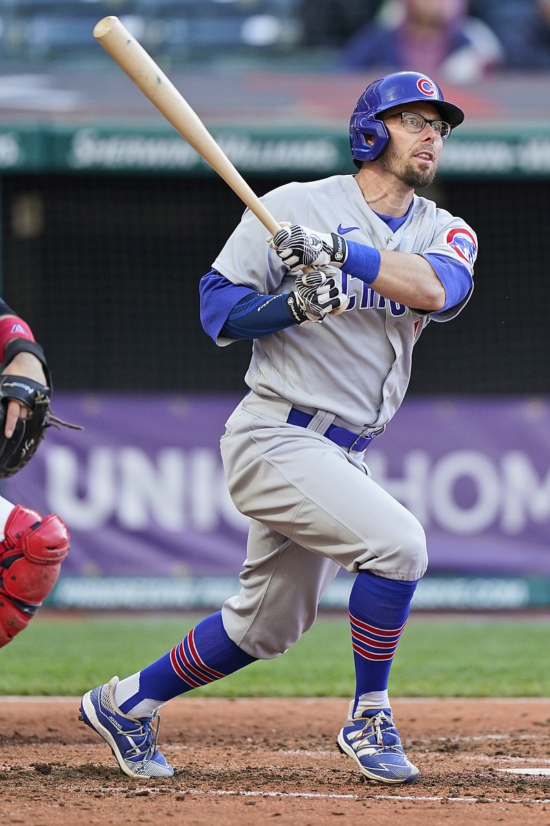 Chicago Cubs' Eric Sogard watches his ball after hitting a solo home run in the fifth inning of a baseball game against the Cleveland Indians, Tuesday, May 11, 2021, in Cleveland. (AP Photo/Tony Dejak)