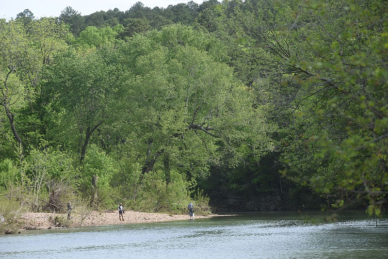 SPRINGTIME FISHING
Anglers fish Wednesday May 12 2021 at the War Eagle River in east Benton County downstream from War Eagle Mill. During spring some species of fish migrate upstream and stack up in front of the mill dam, which attracts fishermen. Go to nwaonline.com/210513 Daily/ to see more photos.
(NWA Democrat-Gazette/Flip Putthoff)