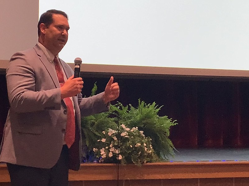 Don Hoover, student services executive director, speaks Wednesday at Bentonville West High School at a community forum for school district rezoning. (NWA Democrat-Gazette/Mary Jordan)