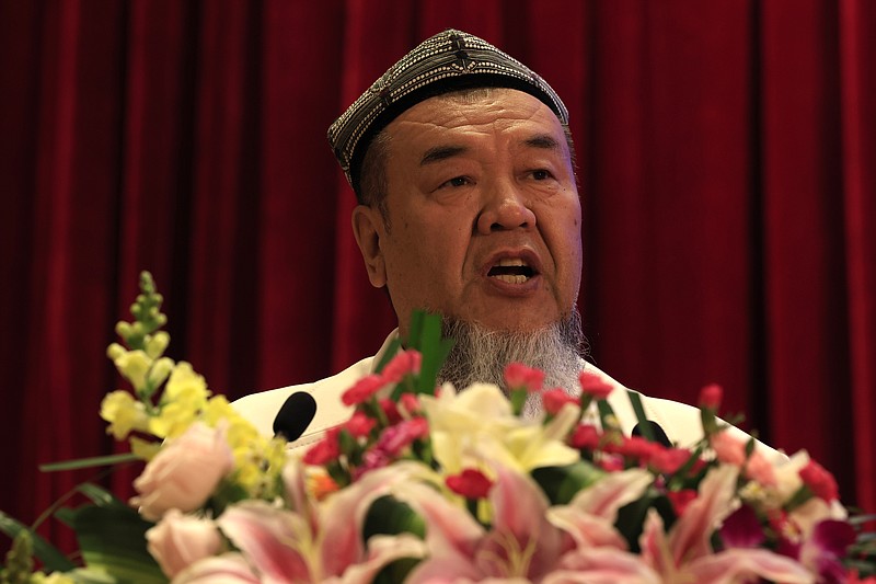 Abdureqip Tomurniyaz, who heads the association and the school for Islamic studies in Xinjiang, speaks during a government reception held for the Eid al-Fitr festival in Beijing on Thursday, May 13, 2021. Muslim leaders from the Xinjiang region rejected Western allegations that China is suppressing religious freedom, speaking at a reception Thursday for foreign diplomats and media at the end of the holy month of Ramadan. (AP Photo/Ng Han Guan)