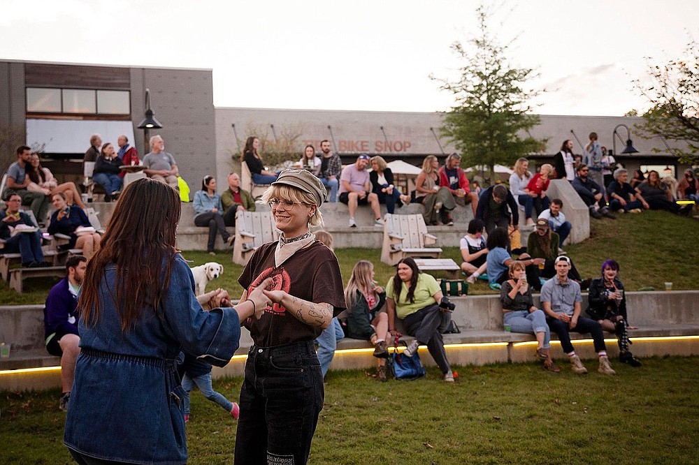 Dancers enjoy a recent Live at Turnbow outdoor concert, part of a music series presented by the Downtown Springdale Alliance in Walter Turnbow Park.
(Courtesy photo)