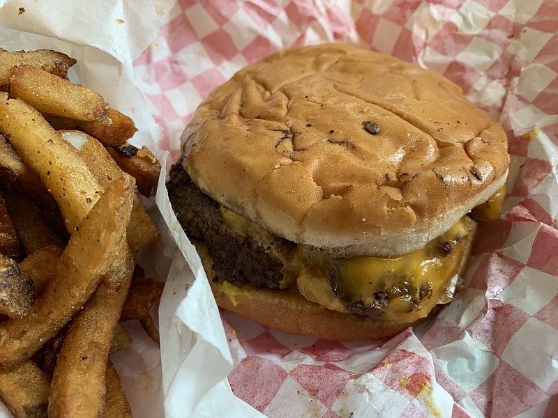 The cheeseburger basket at the Box comes with a cheeseburger, fries and a soft drink. (Arkansas Democrat-Gazette/Eric E. Harrison)