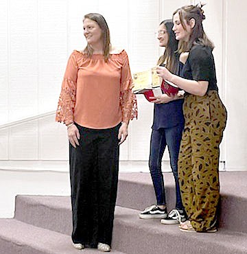 Marc Hayot/Herald-Leader Kaci Reed Johnson (left), presented scholarships to Westville, Oklahoma High School Students Kimberly Castorena and Brooklyn Wors during a scholarship awards ceremony at Westville High School.