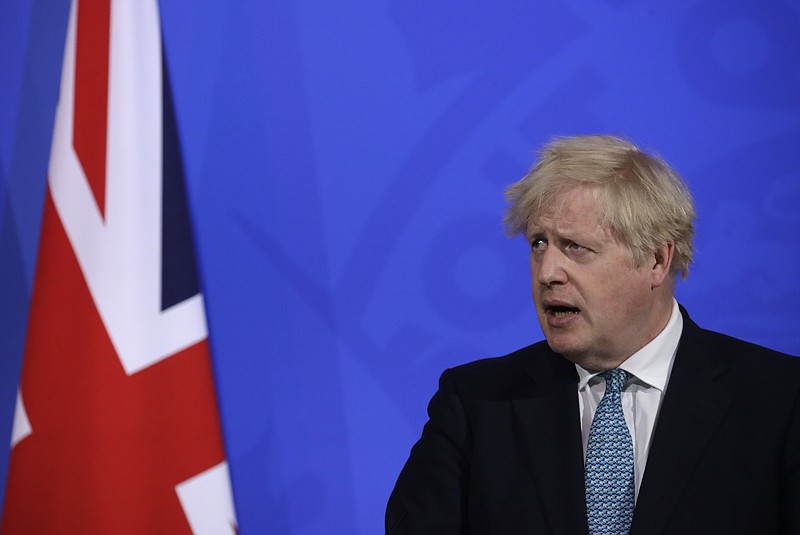 Britain's Prime Minister Boris Johnson speaking at a press conference about the ongoing coronavirus outbreak, in London, Friday, May 14, 2021. (AP Photo/Matt Dunham, Pool)