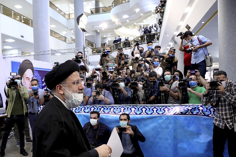 Ebrahim Raisi, head of Iran's judiciary attends the Interior Ministry to register his candidacy for the June 18 presidential elections at the elections headquarters of the Interior Ministry in Tehran, Iran, Saturday, May 15, 2021. (AP Photo/Ebrahim Noroozi)
