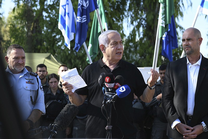 Israeli Prime Minister Benjamin Netanyahu meets with Israeli border police on Thursday, May 13, 2021 in Lod, near Tel Aviv after a wave of violence in the city the night before.  Jewish and Arab mobs battled in the central city of Lod, the epicenter of the troubles, despite a state of emergency and nighttime curfew.  (AP Photo/Yuval Chen, Yediot Ahronot, Pool)