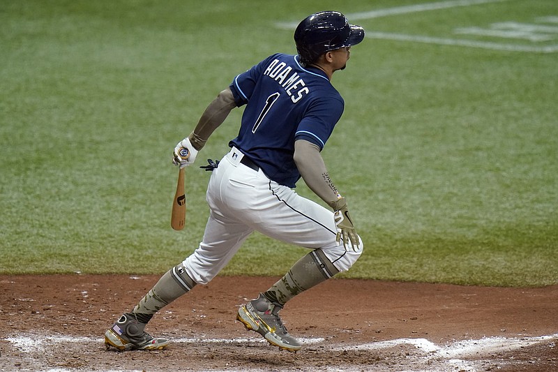 Tampa Bay Rays' Willy Adames watches his two-run double off New York Mets pitcher Joey Lucchesi during the fourth inning of a baseball game Saturday, May 15, 2021, in St. Petersburg, Fla. (AP Photo/Chris O'Meara)