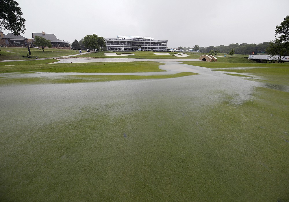 Water ponds on the 18th fairway during a weather delay of the final round of the AT&T Byron Nelson golf tournament in McKinney, Texas, Sunday, May 16, 2021. (AP Photo/Ray Carlin)