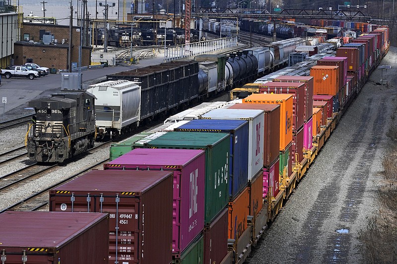 FILE - In this April 2, 2021, file photo train consists are formed at Norfolk and Southern Railroad's Conway Yard in Conway, Pa.  Even as railroads are operating longer and longer freight trains that can stretch for two miles or more, the companies have drastically reduced staffing levels, prompting unions to warn that moves meant to increase profits could endanger safety and even result in disasters.  (AP Photo/Gene J. Puskar, File)