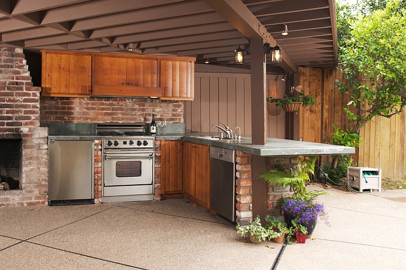 Outdoor kitchens were the most desired additions to the exterior of a home in a recent survey conducted by home improvement resource website Fixr. (Dreamstime via TNS)