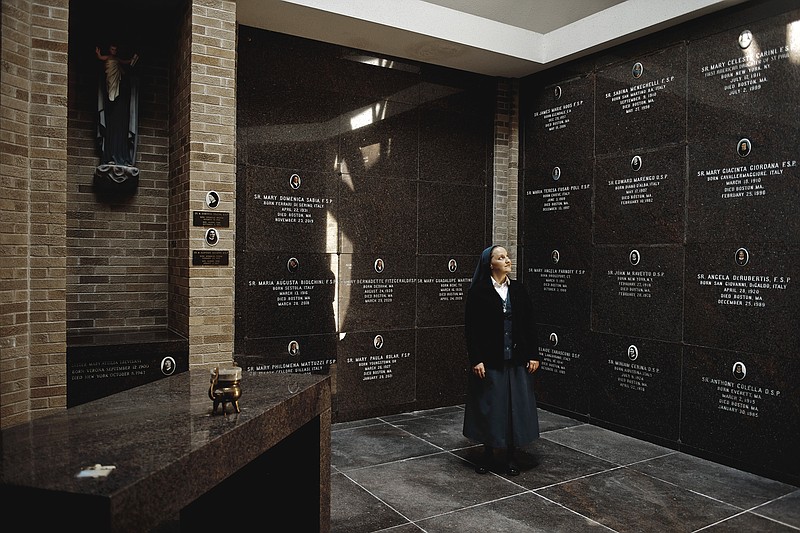 Sister Theresa Aletheia Noble stands in the burial chapel at Boston’s Daughters of St. Paul convent. Alethia’s project of reviving the practice of memento mori has reached Catholics across the country via social media, a memento mori prayer journal — even merchandise emblazoned with a signature skull.
(The New York Times/Tony Luong)