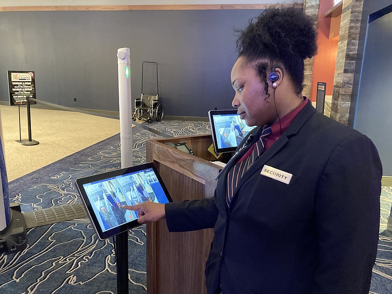 Jerica Scales, a security officer at Saracen Casino Resort, watches a computer screen as someone walks through the casino's new metal-detection system on Tuesday. (Pine Bluff Commercial/Byron Tate)
