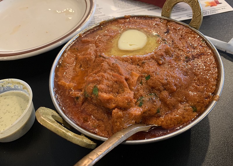 The Butter Chicken at Handi actually comes with a melting pat of butter as a garnish. (Arkansas Democrat-Gazette/Eric E. Harrison)