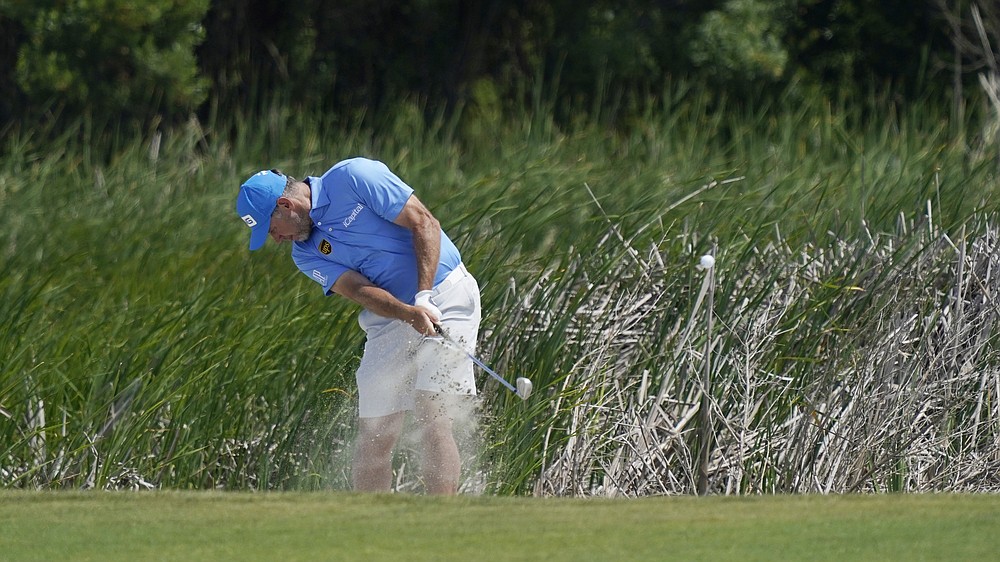 Lee Westwood, of England, hits out of the sand on the sixth hole during a practice round at the PGA Championship golf tournament on the Ocean Course Wednesday, May 19, 2021, in Kiawah Island, S.C. (AP Photo/Matt York)