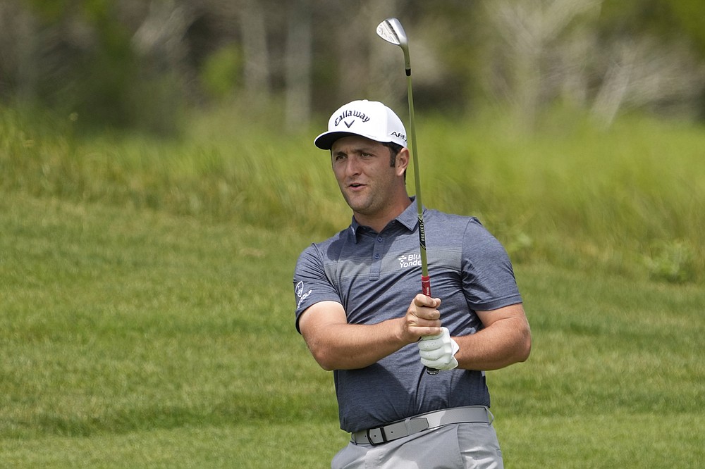 Jon Rahm, of Spain, watches his chip shot to the 10th green during a practice round at the PGA Championship golf tournament on the Ocean Course Wednesday, May 19, 2021, in Kiawah Island, S.C. (AP Photo/David J. Phillip)
