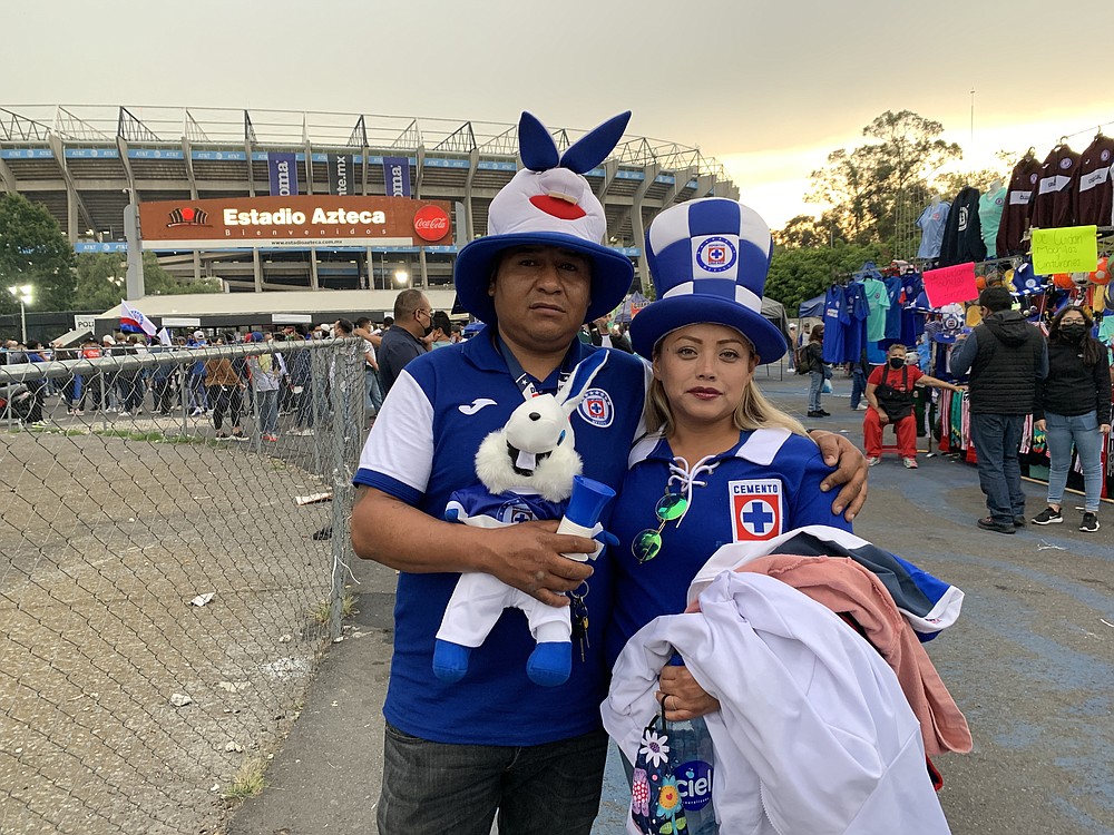 Alvaro Jesus Rosas and his wife, Ivonne Medina, arrive at Azteca Stadium. MUST CREDIT: Washington Post photo by Mary Beth Sheridan.