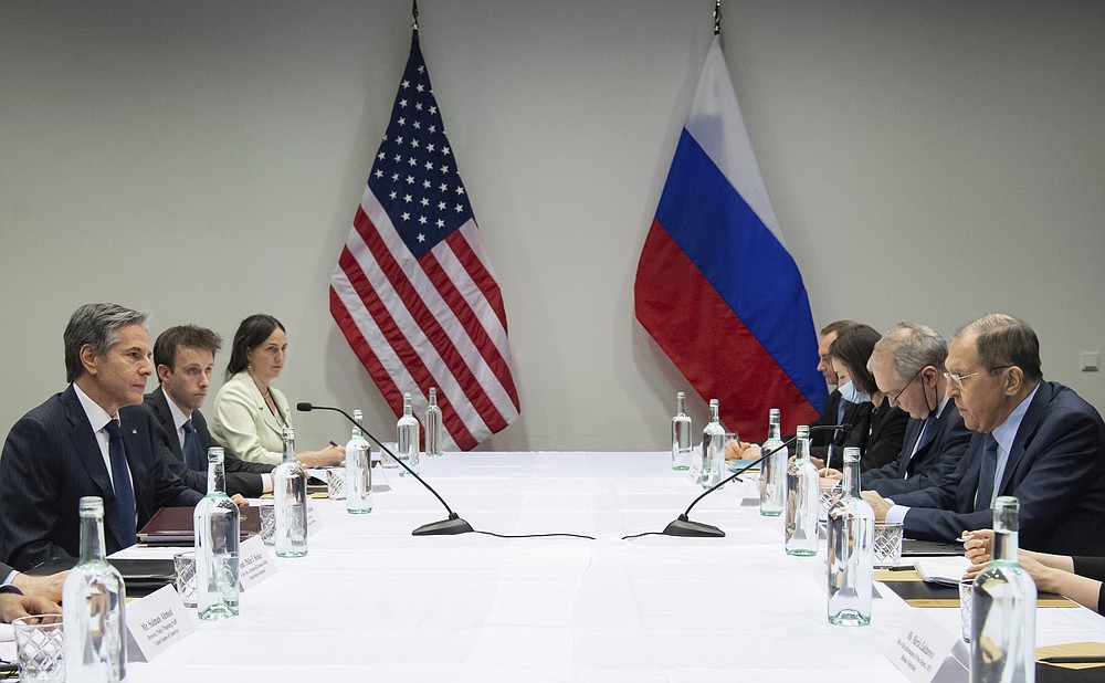 U.S. Secretary of State Antony Blinken, left, meets with Russian Foreign Minister Sergey Lavrov, right, at the Harpa Concert Hall in Reykjavik, Iceland, Wednesday, May 19, 2021, on the sidelines of the Arctic Council Ministerial summit. (Saul Loeb/Pool Photo via AP)