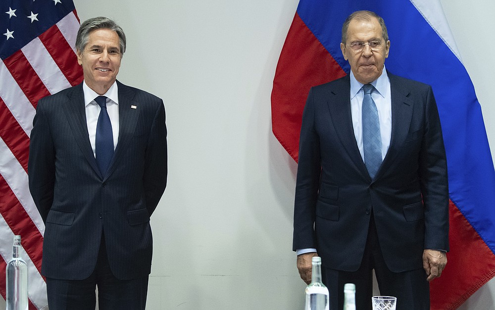 U.S. Secretary of State Antony Blinken, left, poses with Russian Foreign Minister Sergey Lavrov, right, before a meeting at the Harpa Concert Hall in Reykjavik, Iceland, Wednesday, May 19, 2021, on the sidelines of the Arctic Council Ministerial summit. (Saul Loeb/Pool Photo via AP)